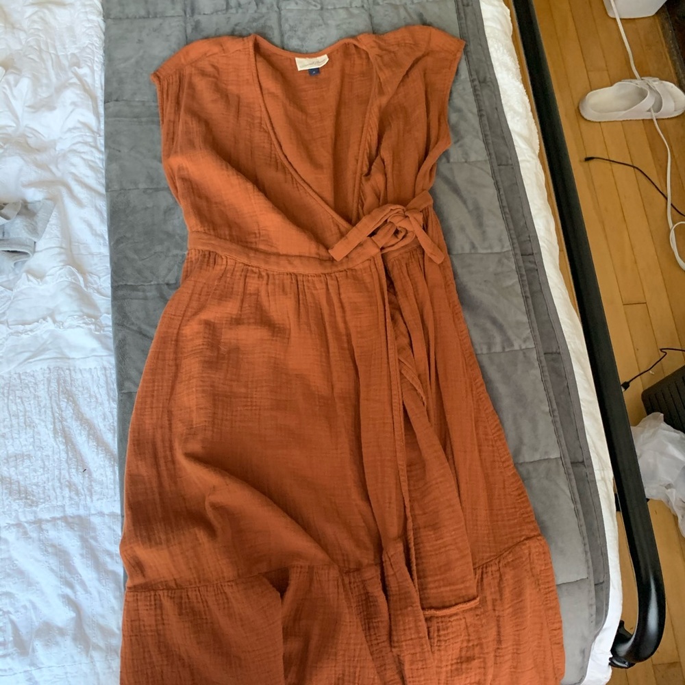 Orange midi length wrap dress